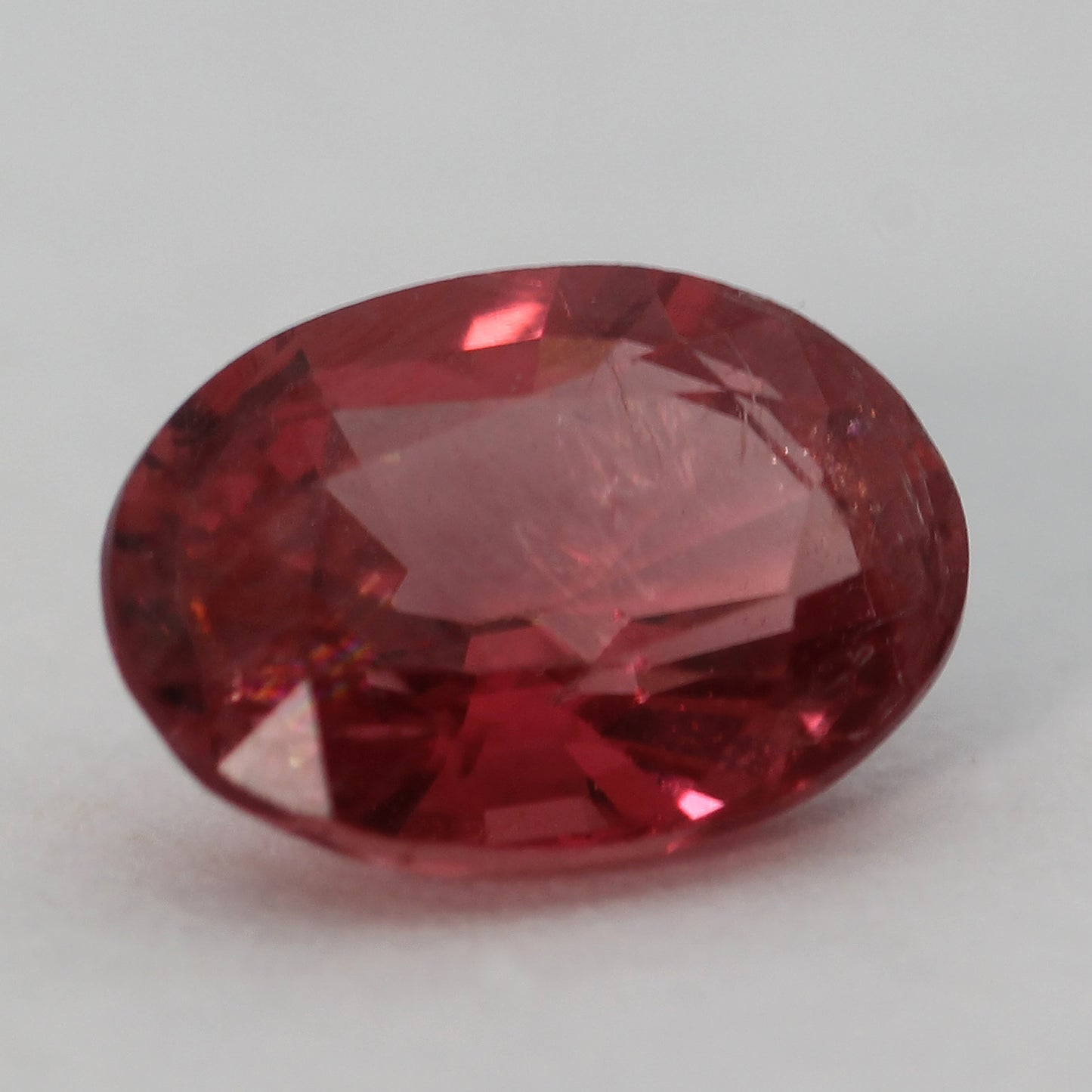 oval faceted red spinel 0.88ct