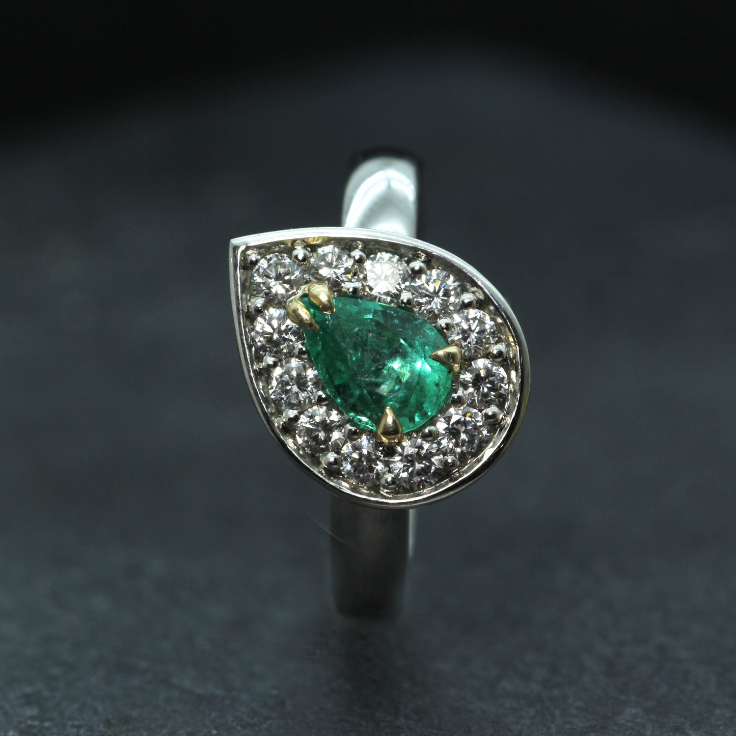 Platinum, Emerald and Diamond Halo ring