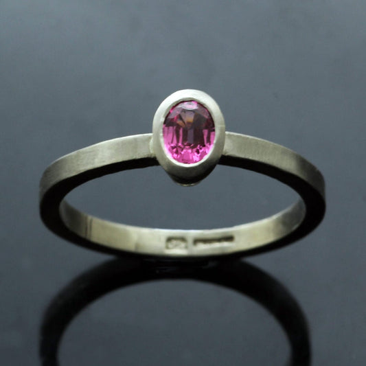 OVAL CUT HOT PINK SPINEL SET IN 18CT WHITE GOLD