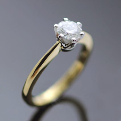 ROUND BRILLIANT 0.6CT CUT SOLITAIRE DIAMOND SET IN PLATINUM & 18CT YELLOW GOLD