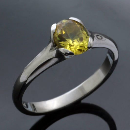 ROUND BRILLIANT CUT CHRYSOBERYL SET IN PALLADIUM FLOWER RING