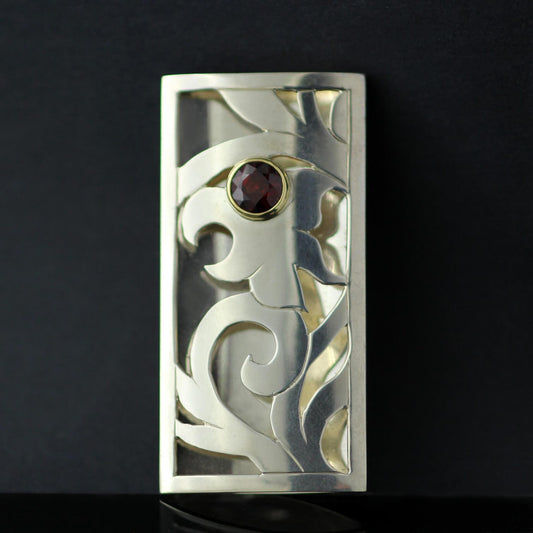 SPECETITE GARNET SET IN 18CT YELLOW GOLD & STERLING SILVER HAND PIERCED BROOCH