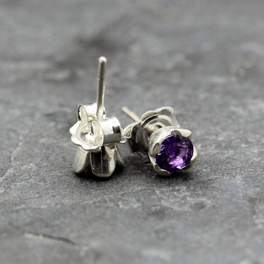 ROUND BRILLIANT CUT AMETHYST SET IN STERLING SILVER STUD EARRINGS