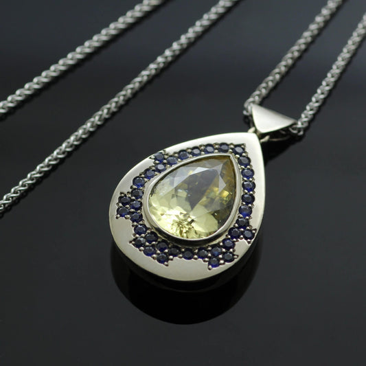 PEAR CUT ZIRCON & SAPPHIRES SET IN 18CT WHITE GOLD PENDANT