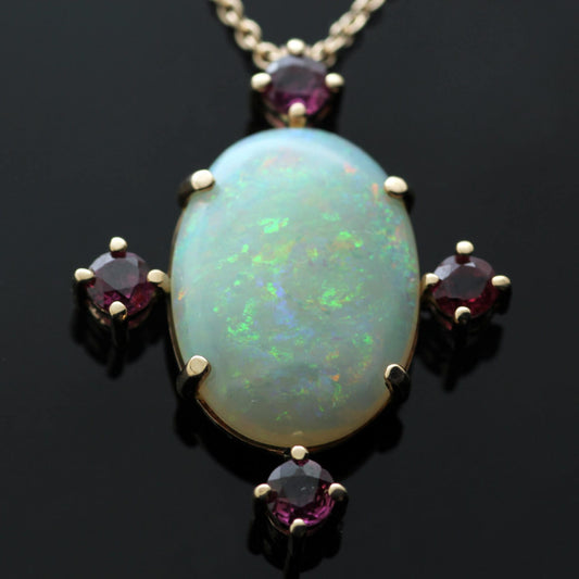 CABOCHON CUT OPAL & RUBIES SET IN 18CT ROSE GOLD PENDANT