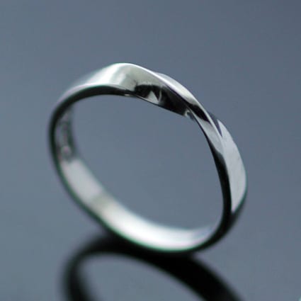 PLATINUM MOBIUS TWIST FLAT WEDDING BAND