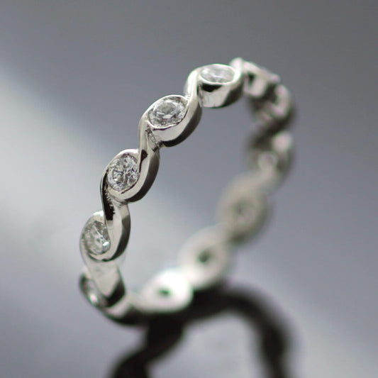 TWELVE DIAMOND WAVE SET IN PLATINUM BESPOKE ETERNITY BAND