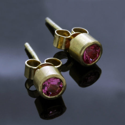 ROUND BRILLIANT PINK SPINELS SET IN 18CT YELLOW GOLD STUD EARRINGS