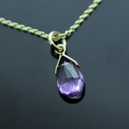 AMETHYST BRIOLETTE SET IN 9CT YELLOW GOLD