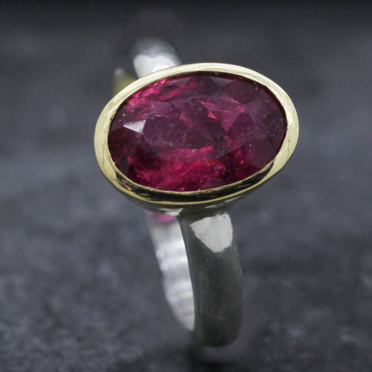 OVAL PINK TOURMALINE SET IN 18CT YELLOW GOLD & STERLING SILVER