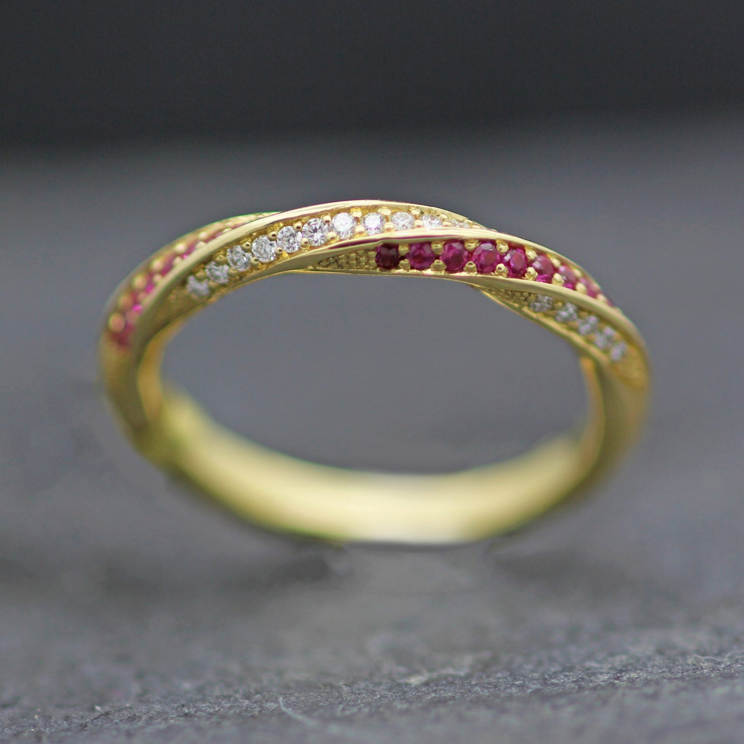 CANDY TWIST RUBY & DIAMONDS SET IN 18 YELLOW GOLD HALF ETERNITY RING