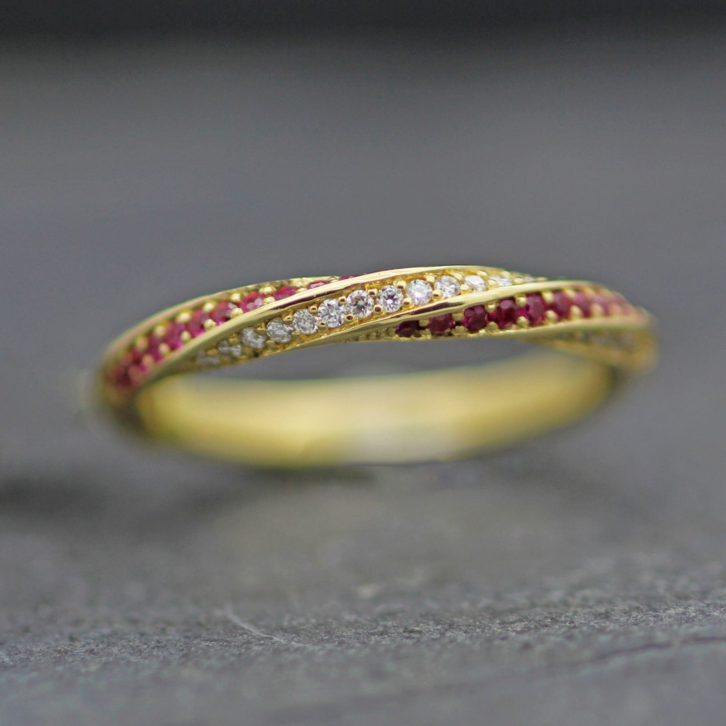 CANDY TWIST RUBY & DIAMONDS SET IN 18 YELLOW GOLD HALF ETERNITY RING